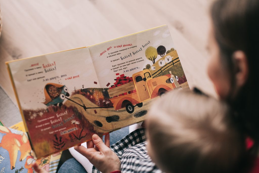 Canva - Woman Reading Book to Toddler